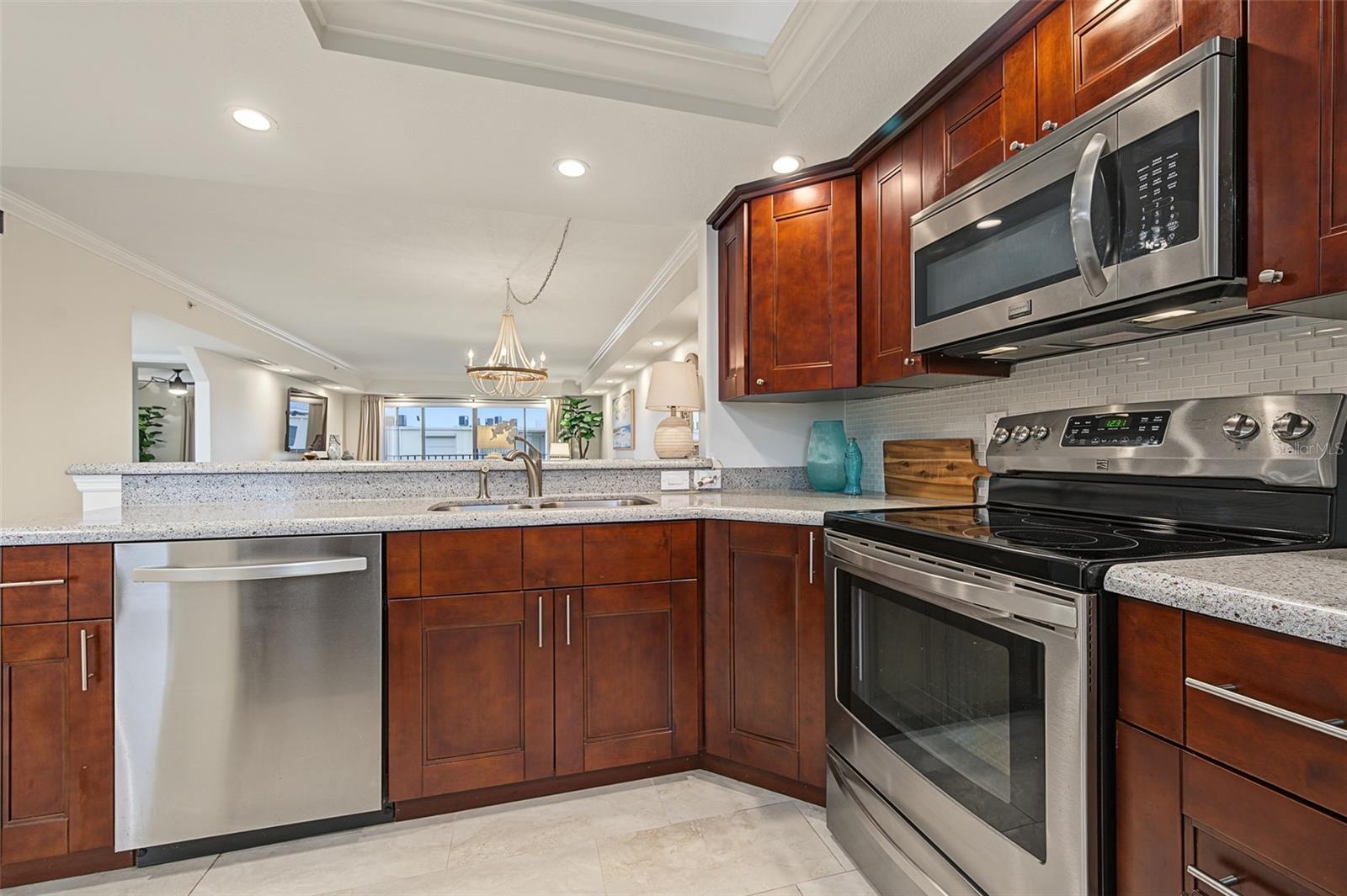 Looking over the Breakfast Bar and into the Dining and Living Rooms