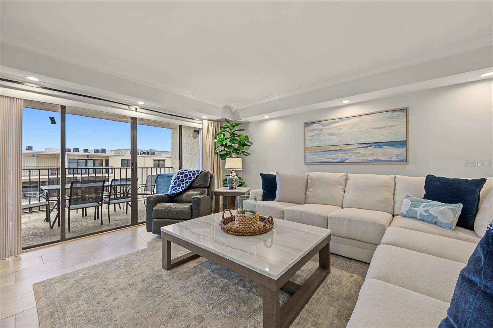 Living Room with Sliding Glass Doors to the Waterfront Balcony