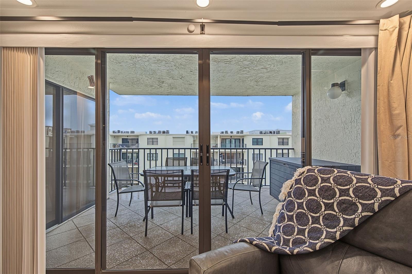Sliding Glass Doors off the Living area directly onto the Waterfront Balcony