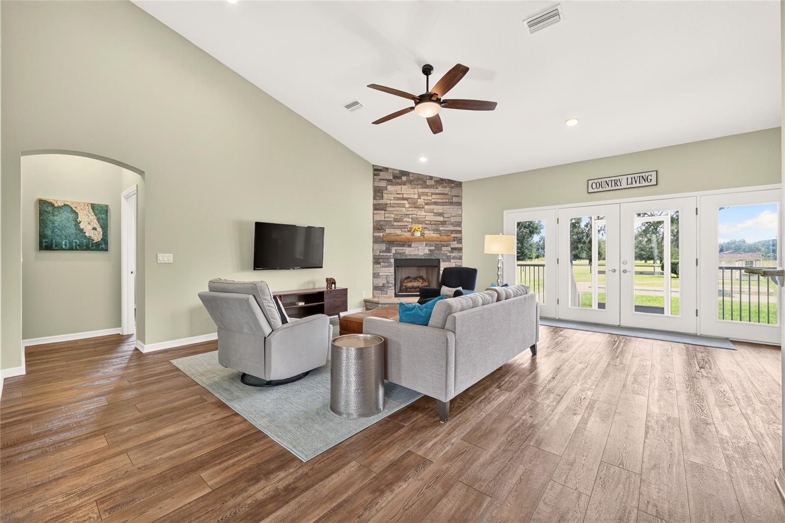 Open concept living area enjoys natural light and beautiful views of the east pastures.
