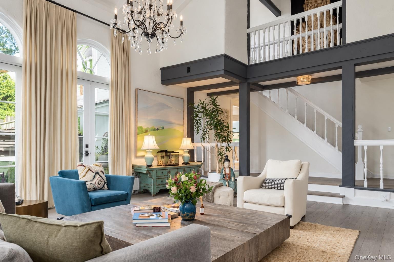 View of living room to second floor landing