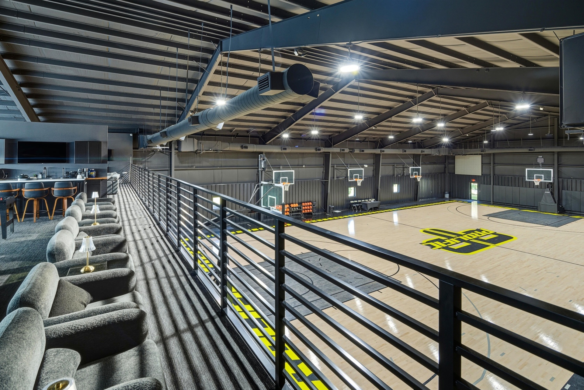 FACILITY BASKETBALL COURT WITH UPSTAIRS BAR AND SEATING