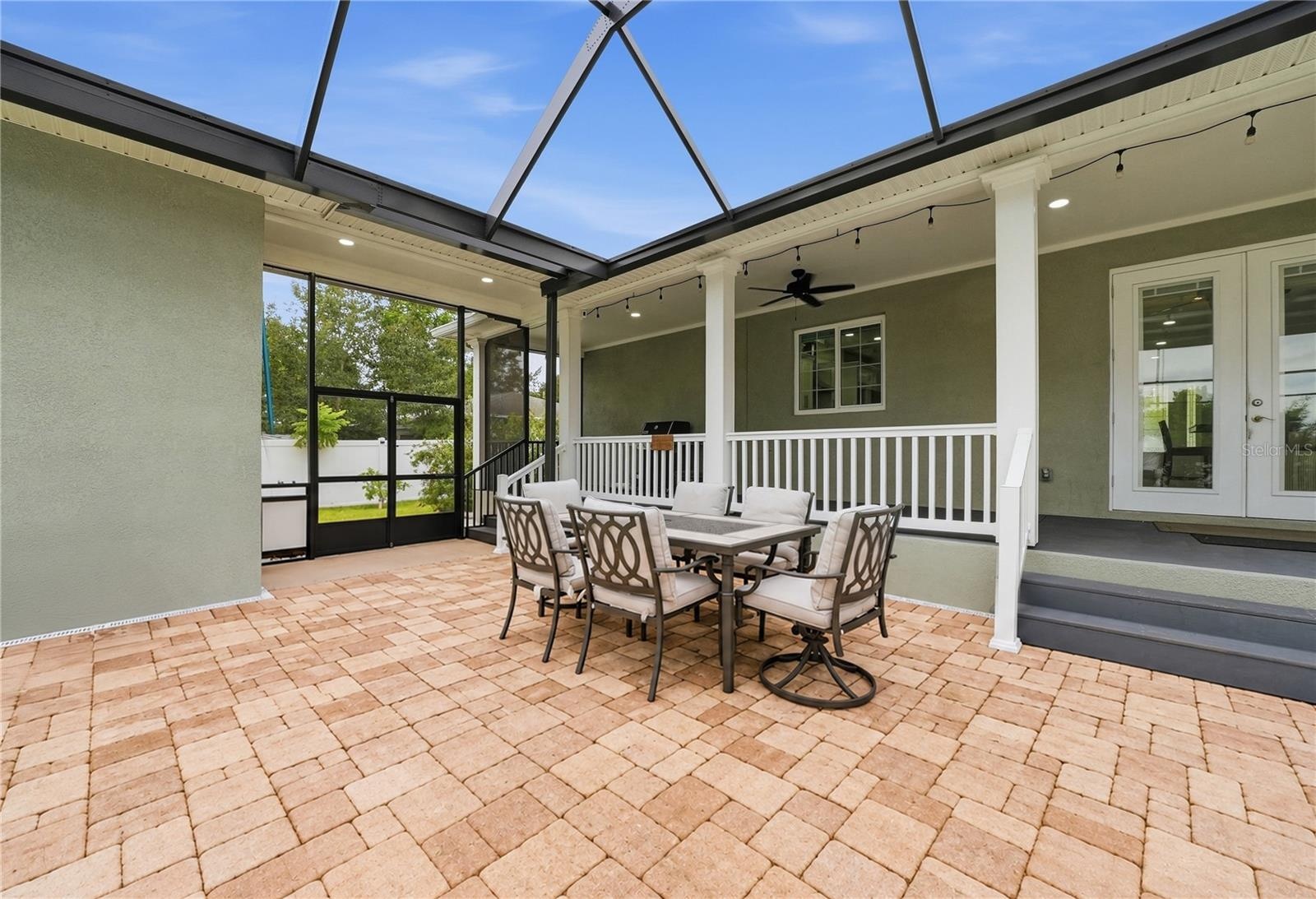 Covered porch overlooking screened lanai