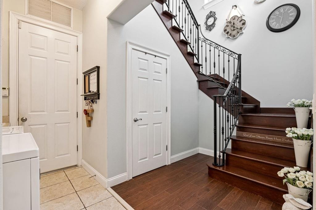 Door to garage and stairway to 2nd floor