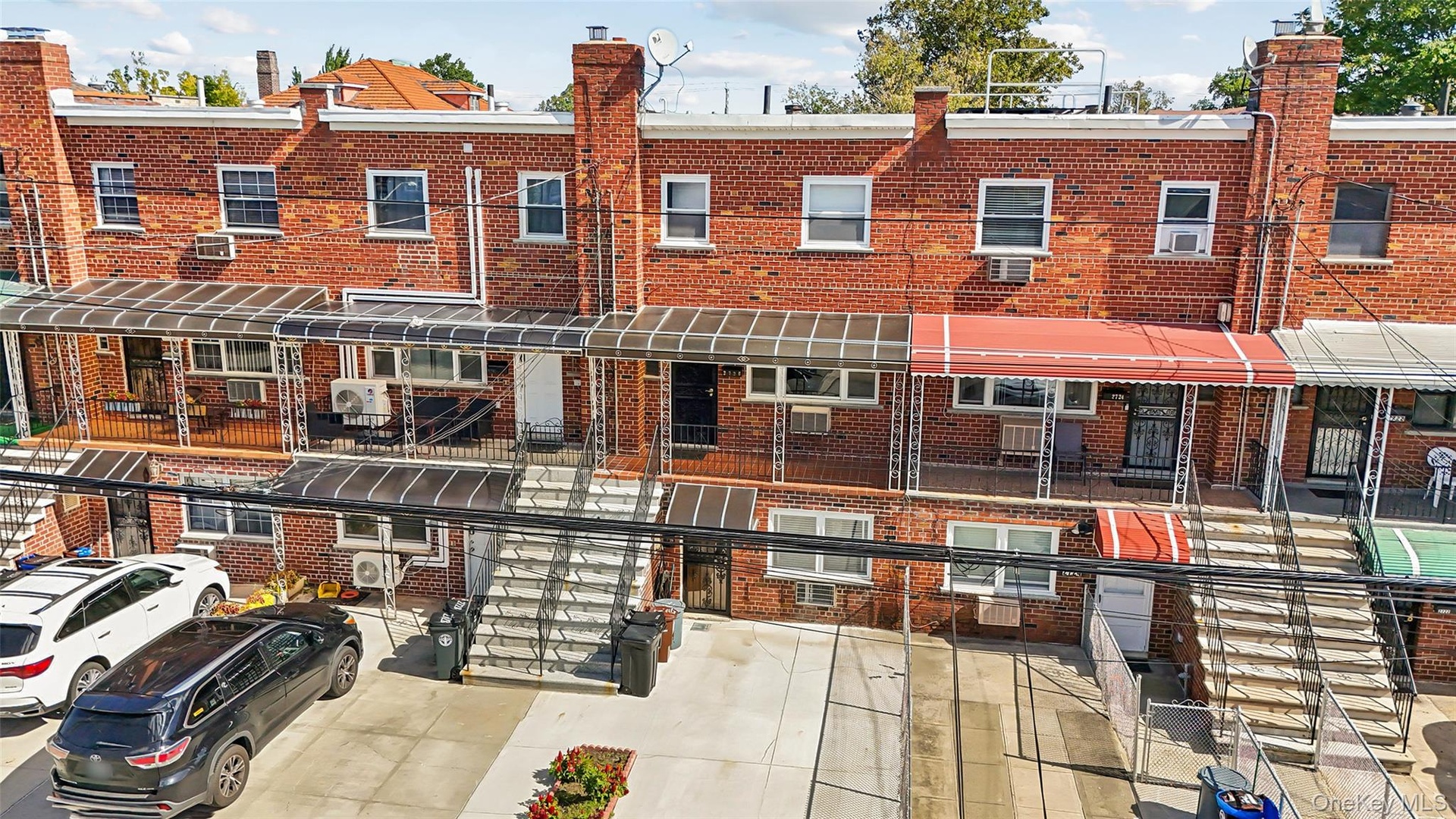 Brick exterior with multiple windows and covered entryways