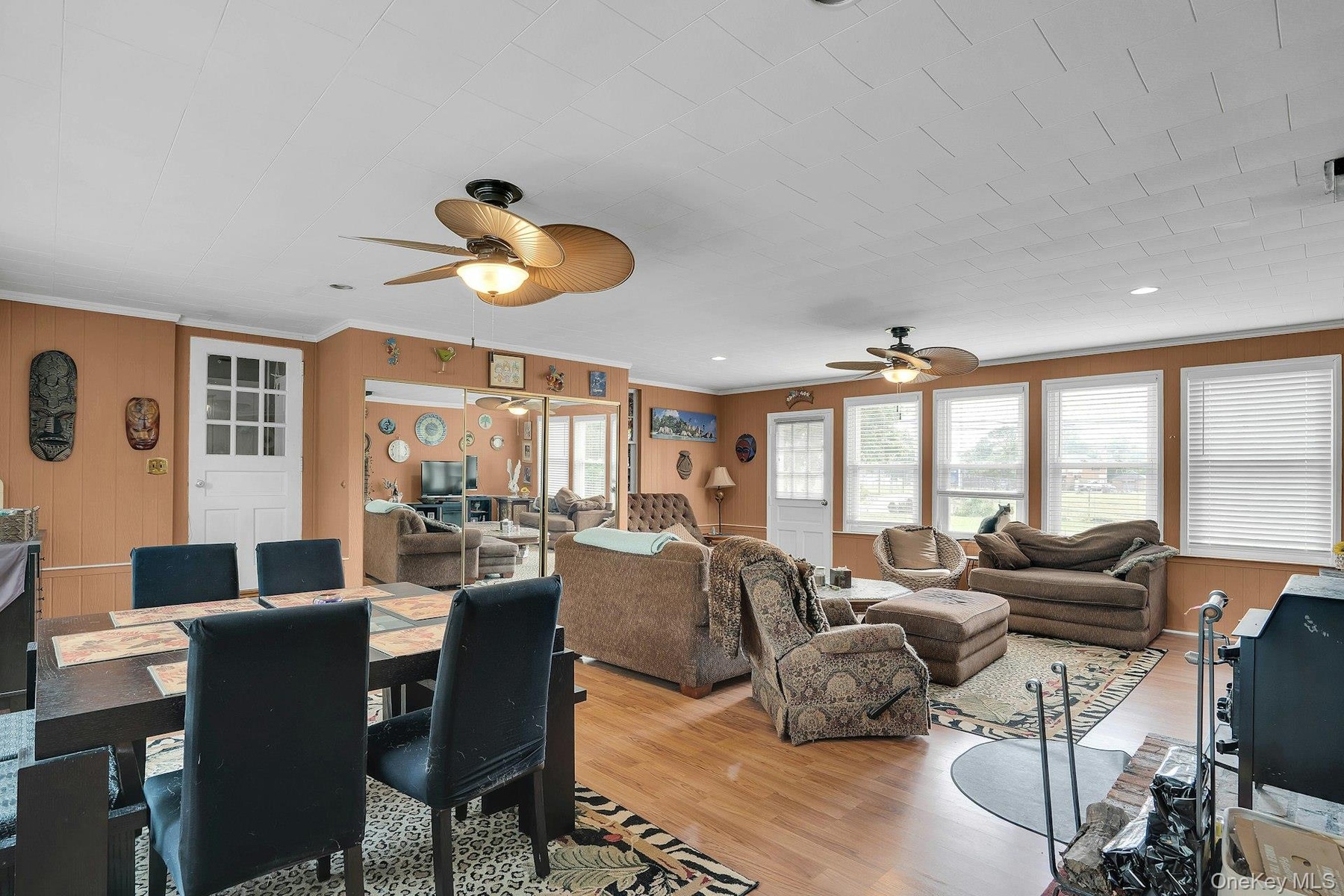 Hardwood Flooring and walls of windows.