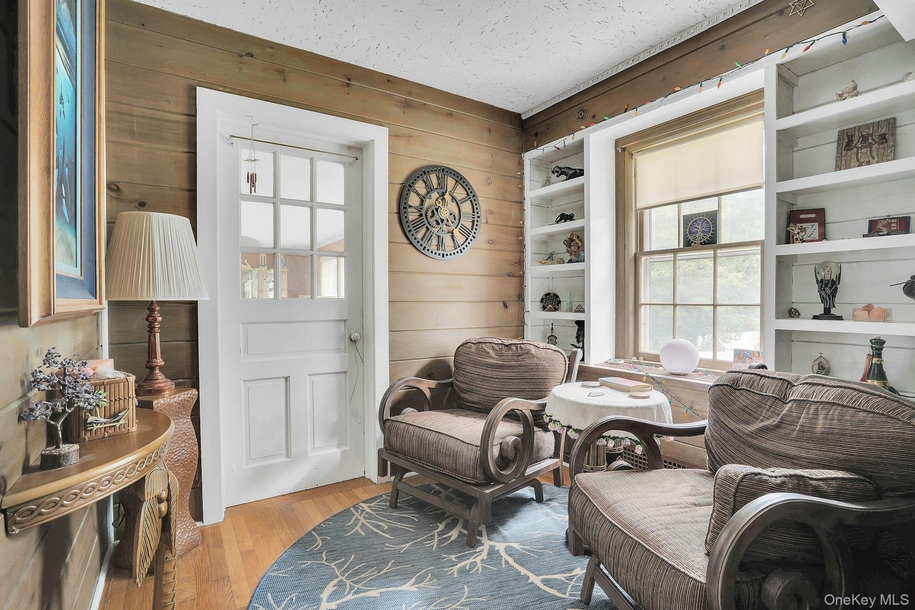 Cozy little library with built-in bookcases.