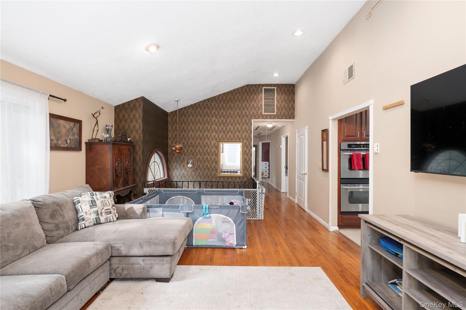 Living Room with entrance way to hall to bedrooms.