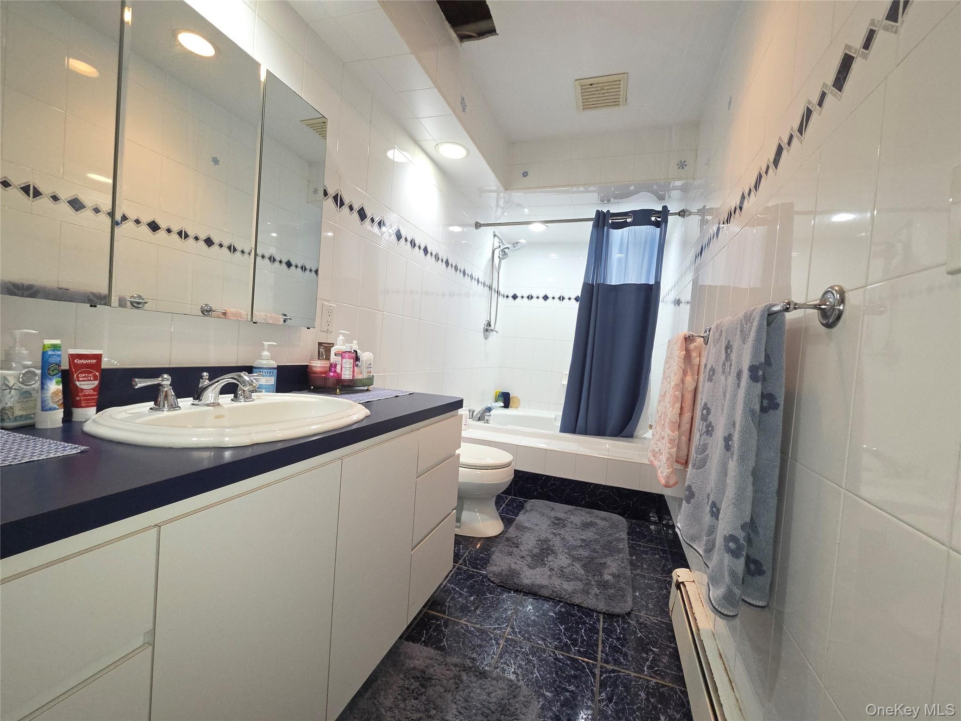 Hallway full bathroom.  Large enough to put double sinks if desired.