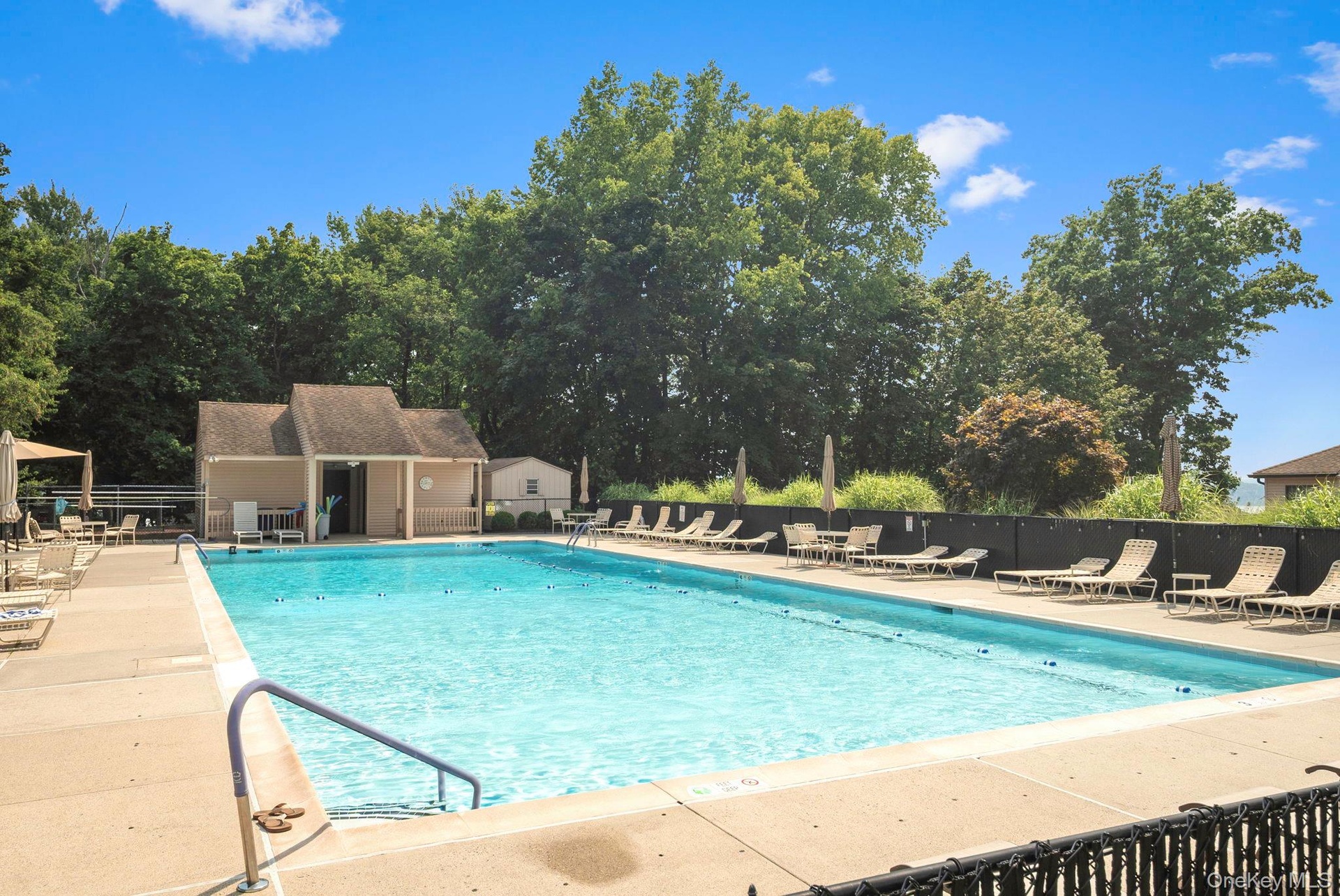 Community Pool with plenty of space to enjoy the sun and lounge!