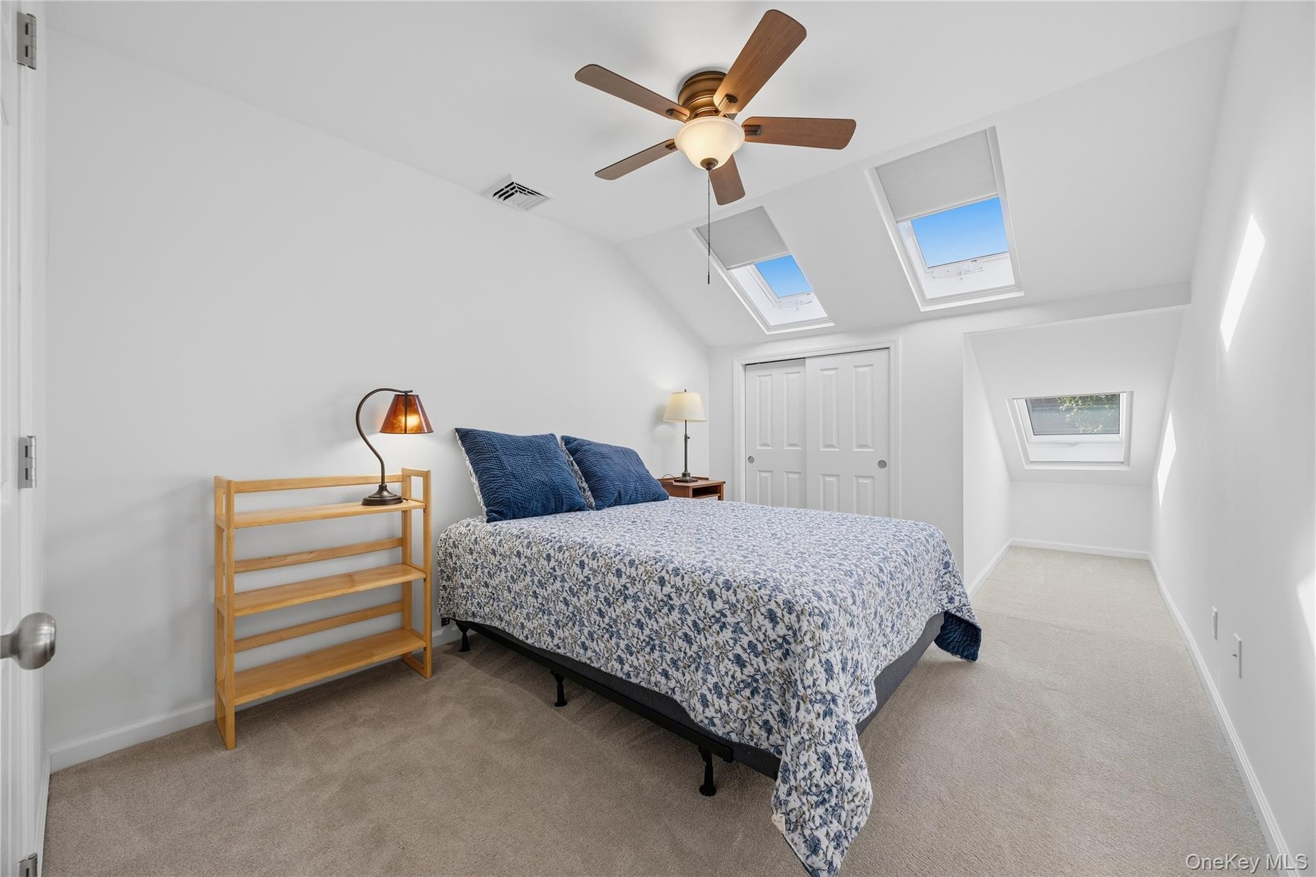 Second Bedroom with ceiling fan, double wide closet & 3 skylights