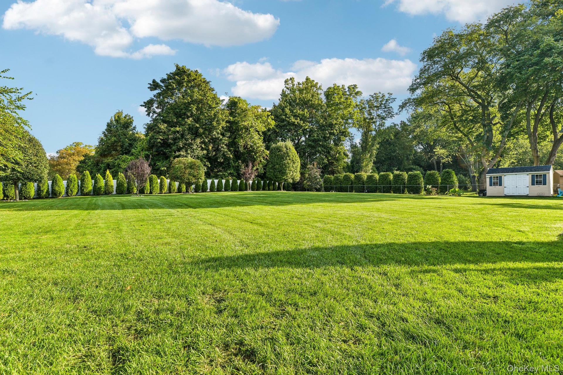 Over 1 Acre of manicured property.  Storage Shed.
