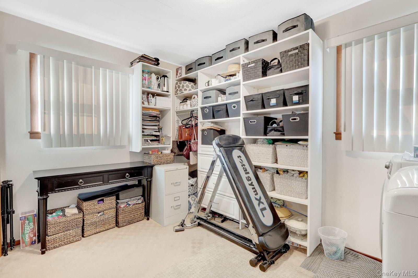 First Floor bedroom,currently being used as a walk-in closet, with laundry area