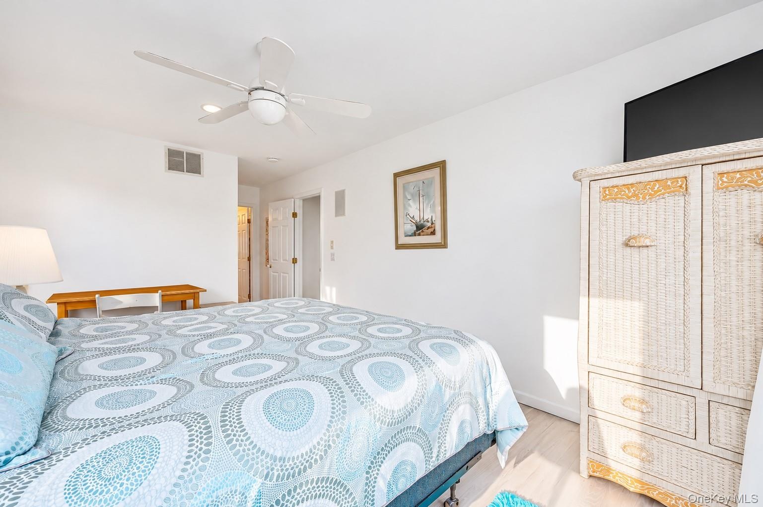 En Suite featuring large walk-in closets
