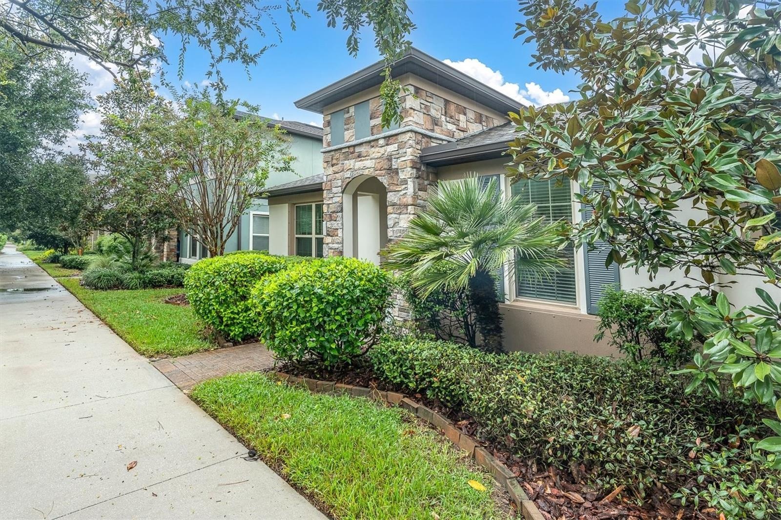 Front yard with landscaping and walkway