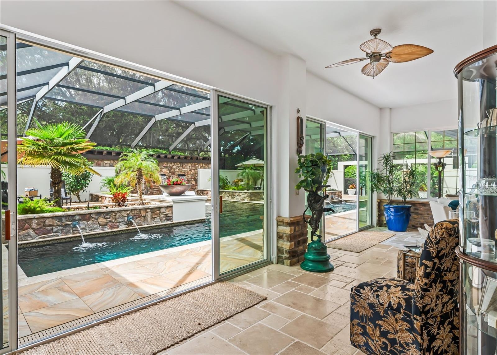 3 Sets of Sliding Glass Doors Overlooking Pool Area