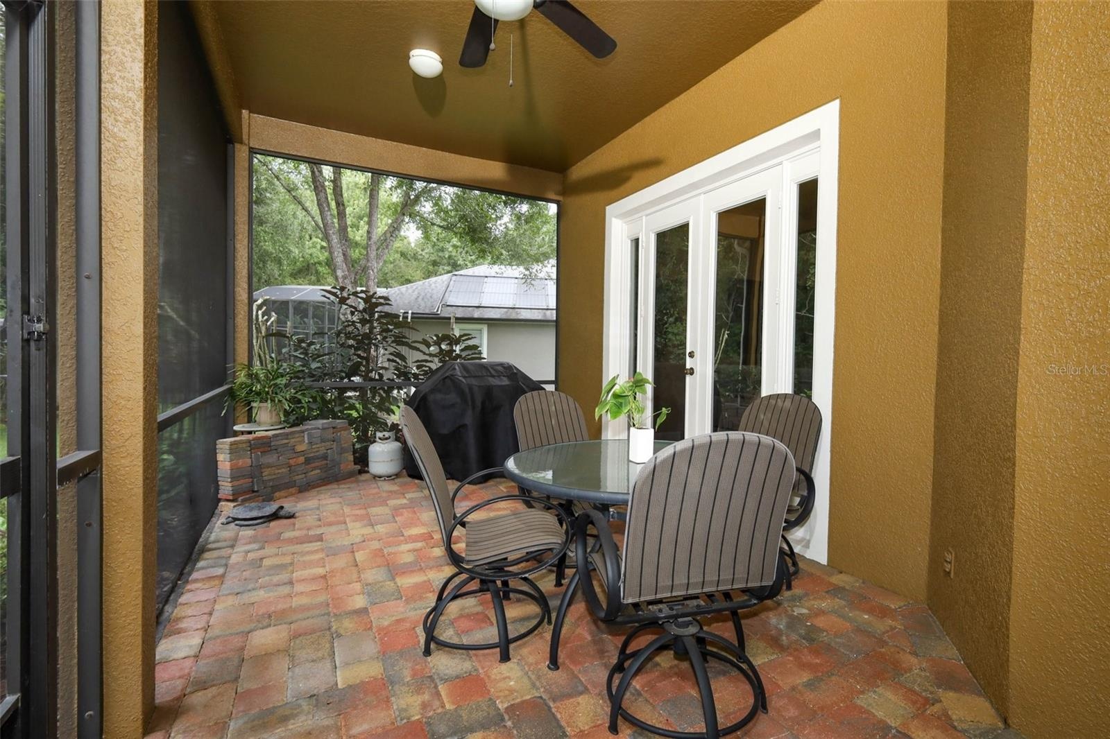 Screened lenai with paver brick all the way to the Gazebo