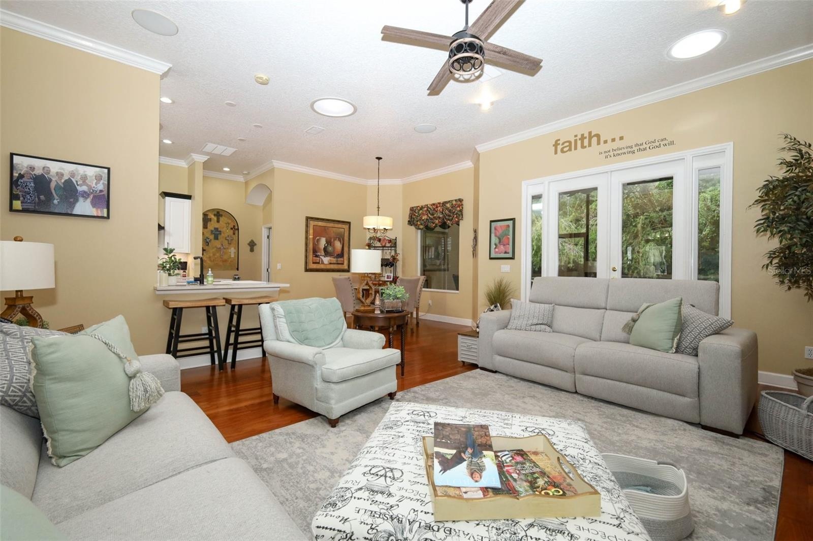 Family room looking in to breakfast nook and french doors leading to screened porch