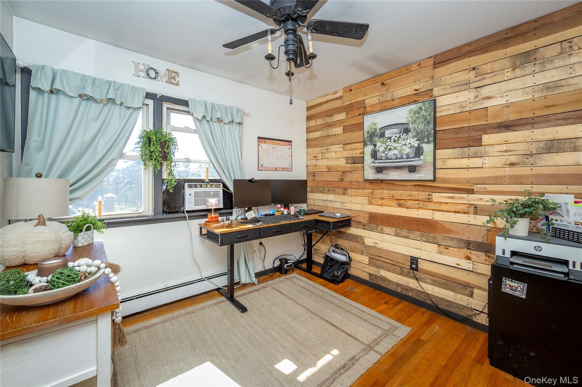 One of the bedrooms is currently being used as a home office.