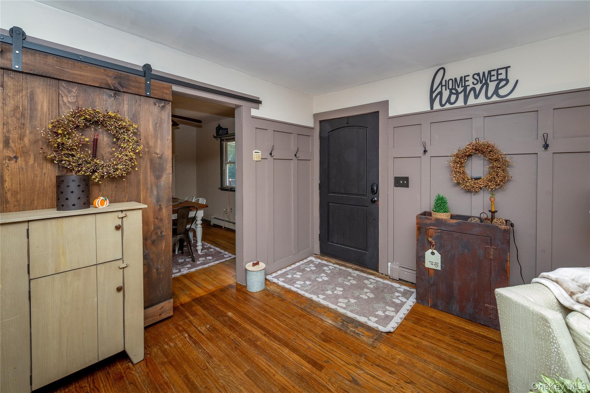 Inside, the spacious living room greets you with hardwood floors.