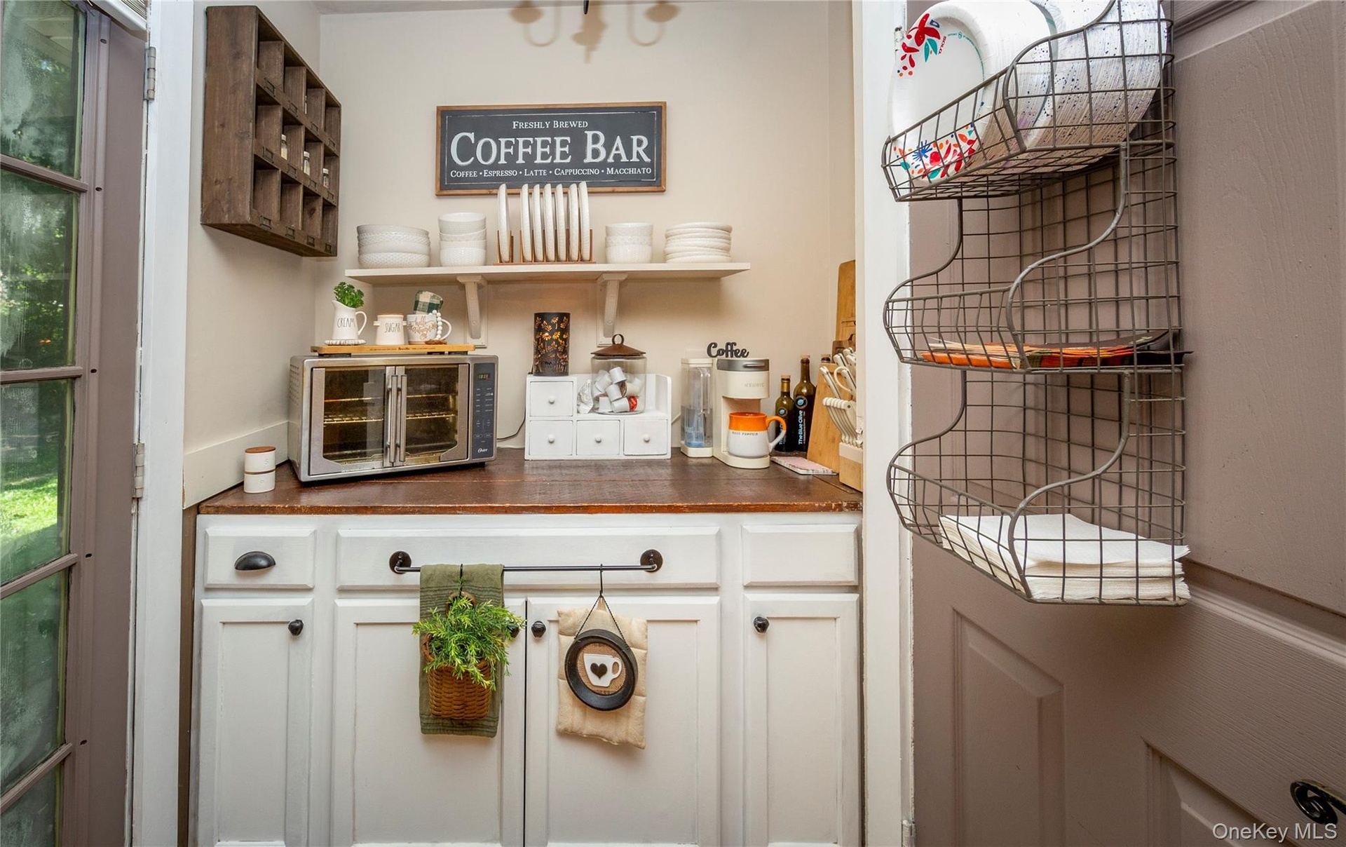 And could easily become the perfect coffee bar. Door on the left leads to the back patio.