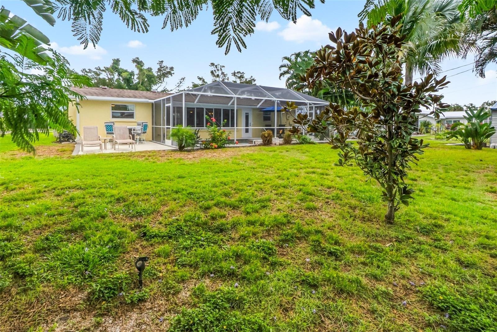 Rear exterior and backyard lawn.