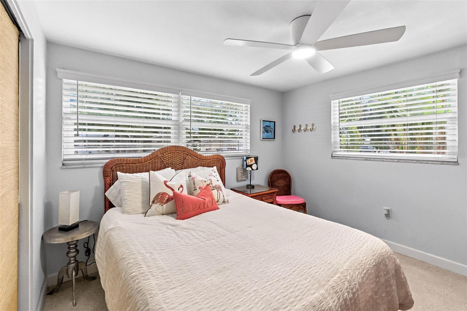 Guest bedroom with windows on two sides.