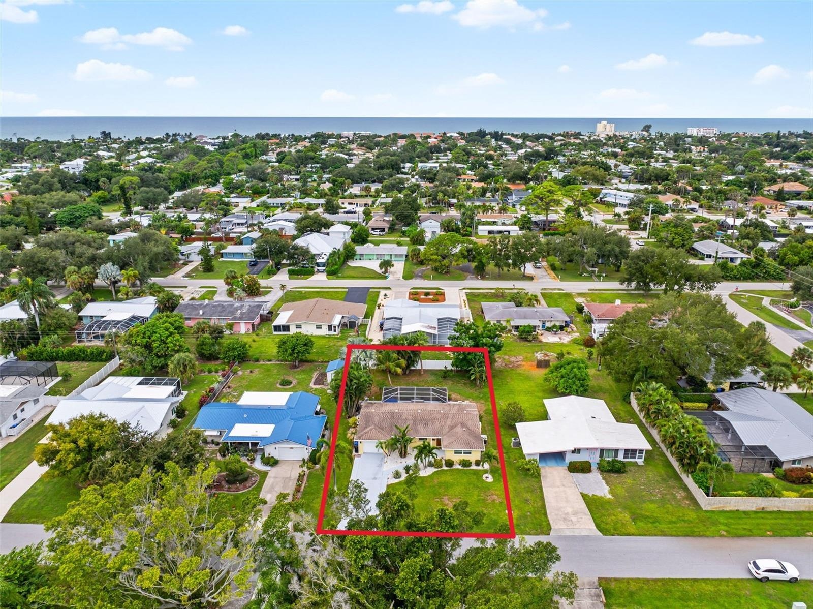 Aerial view of the home and surrounding neighborhood with close proximity to Gulf.
