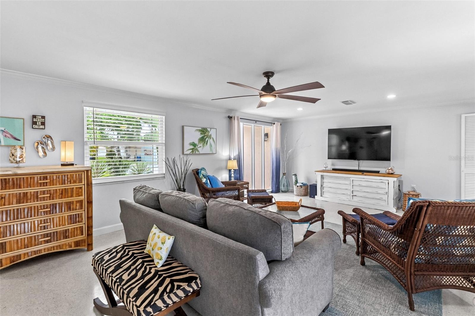 Living room with comfortable seating and coastal furnishings.