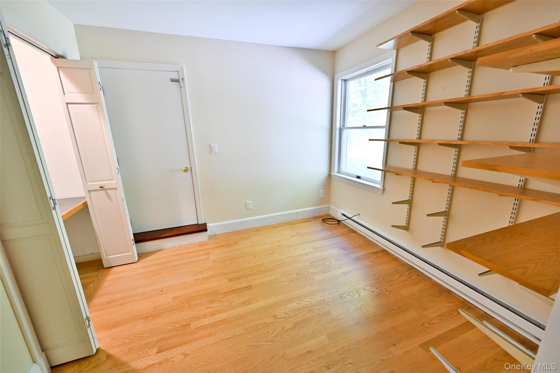 Office attached to primary bedroomDoor leads to deck