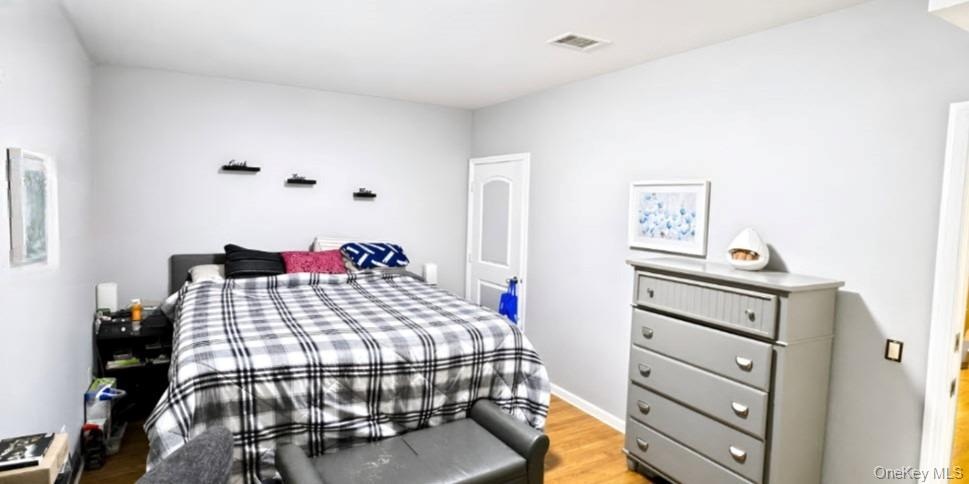 Light-toned walls complement wood-finish flooring