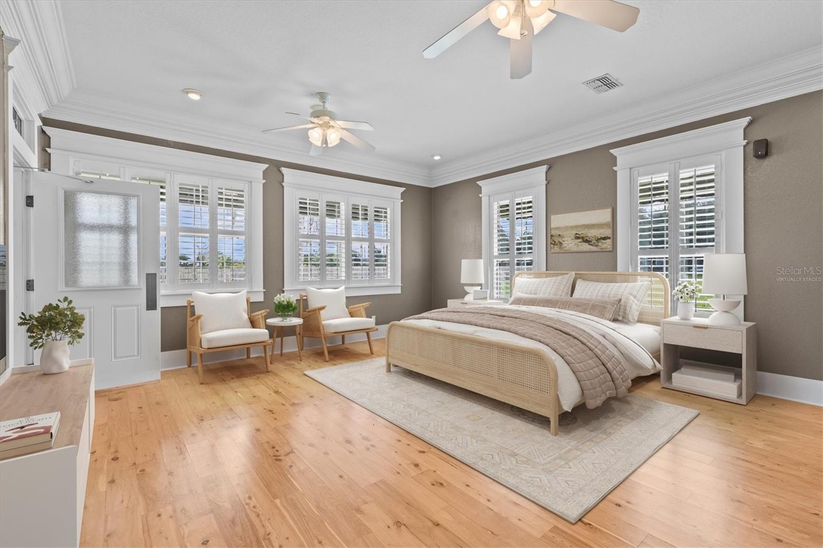 One of the Primary Bedroom Suites Virtually Staged