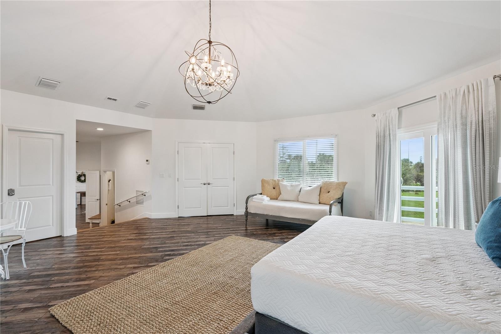 Primary suite: Spacious coastal retreat with ocean views, two large walk-in closets, and access to an oversized composite terrace overlooking the Atla