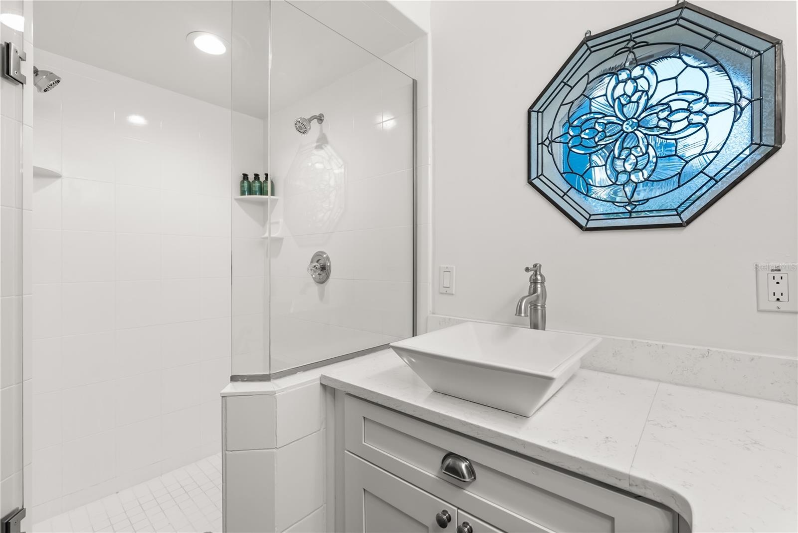 Master ensuite bathroom with updated finishes and statement window and skylight