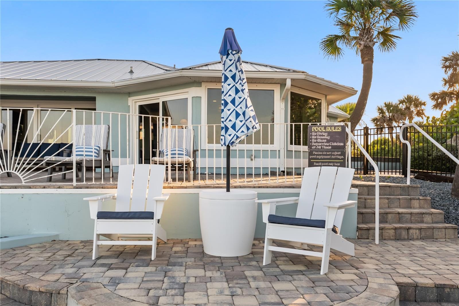 new poolNew oceanfront pool installed in 2024, featuring heating, a sun shelf, bubblers, and a 7-foot-deep end, with expansive patio space and panoram