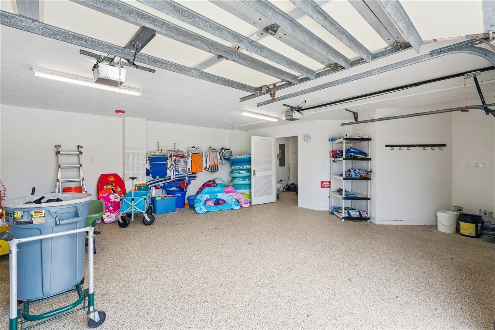 Garage: Attached garage with an extra dryer and plentiful pool and beach toys.