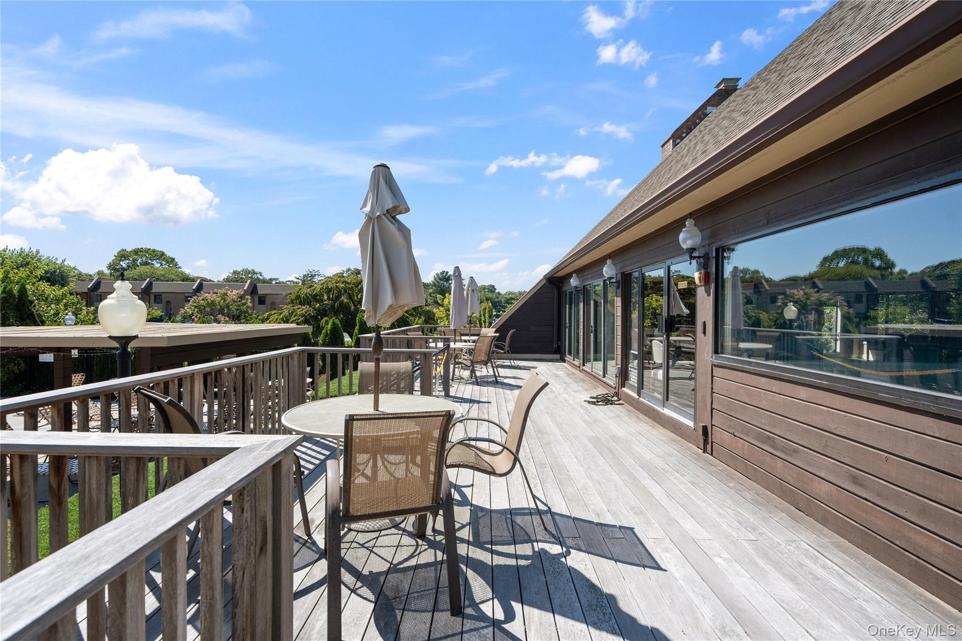 Deck Overlooking The Pool Behind Clubhouse!