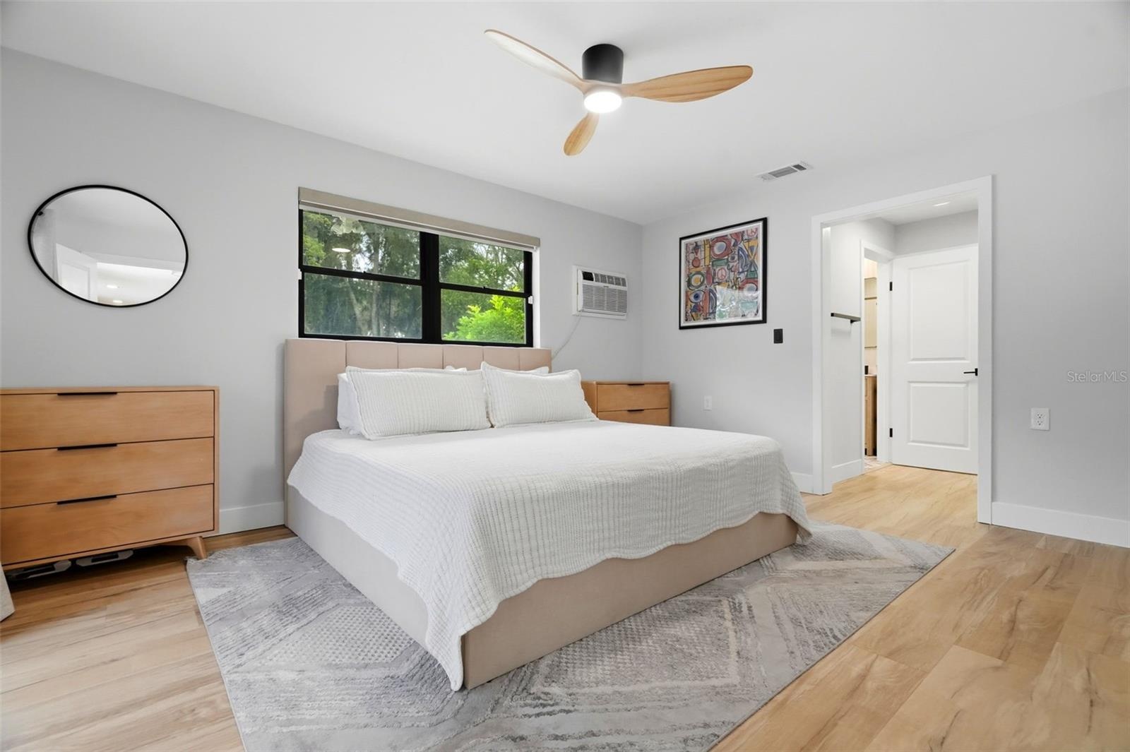 Primary Bedroom with Electronic Blinds & Extra window AC for those who like it extra cold at night!