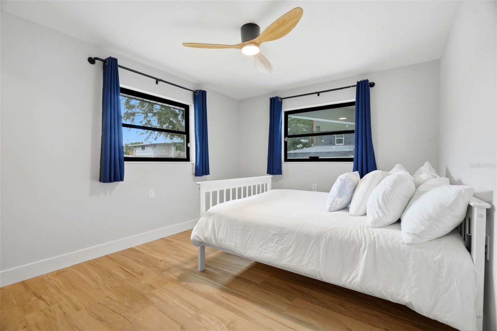 Bedroom 2 overlooking the pool and backyard