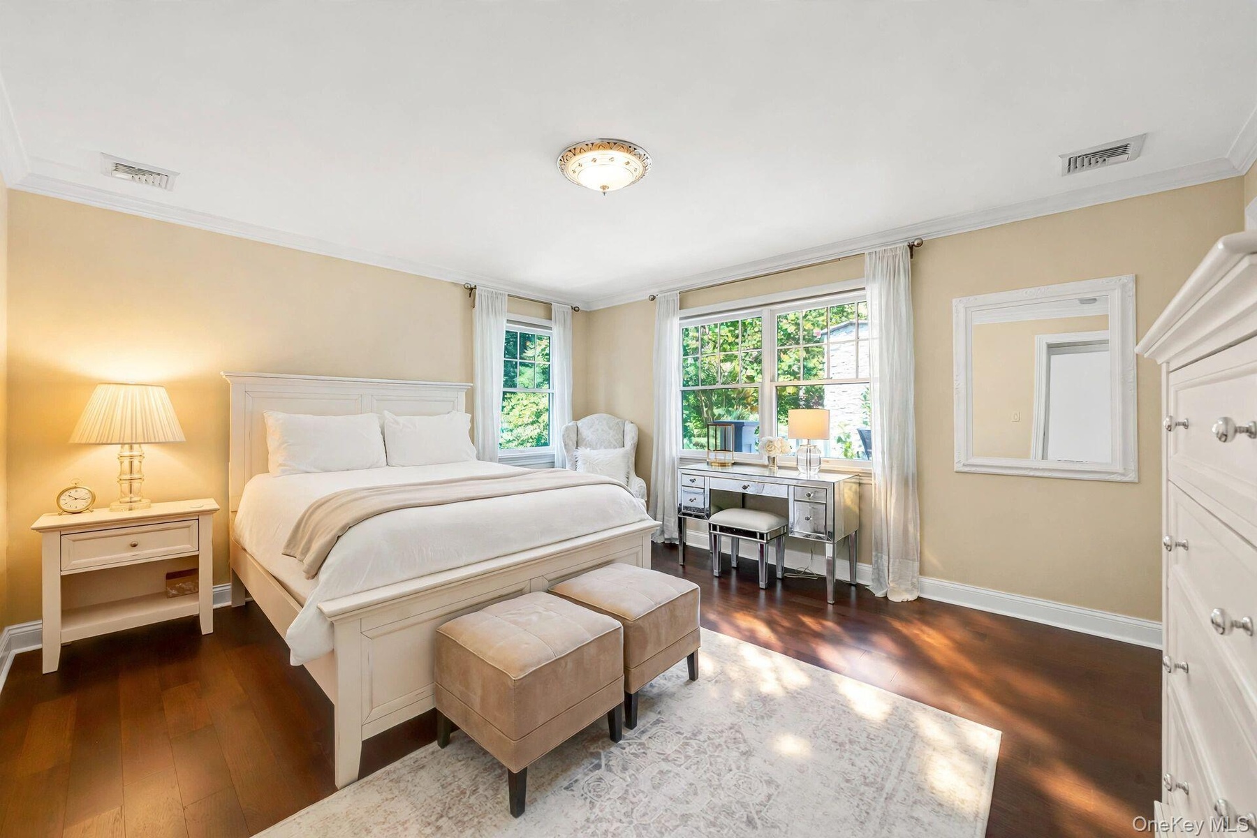 Wood-finish flooring, crown molding, and recessed lighting