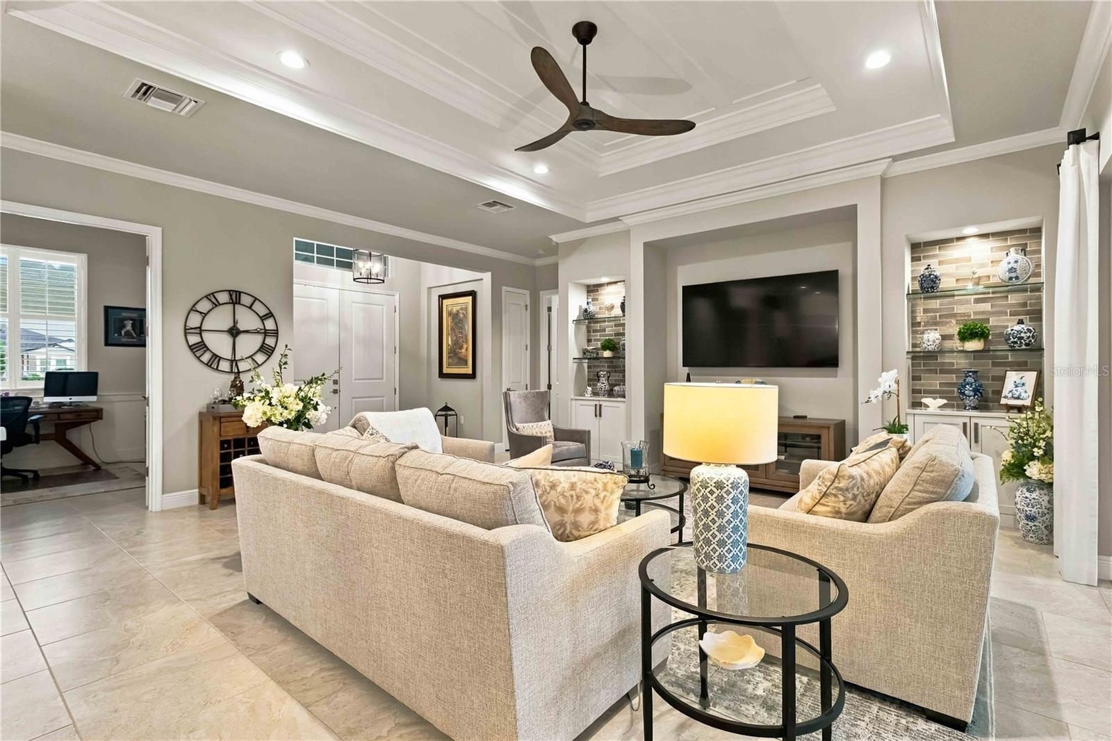 Great Room with Crown Molding & Tray Ceiling