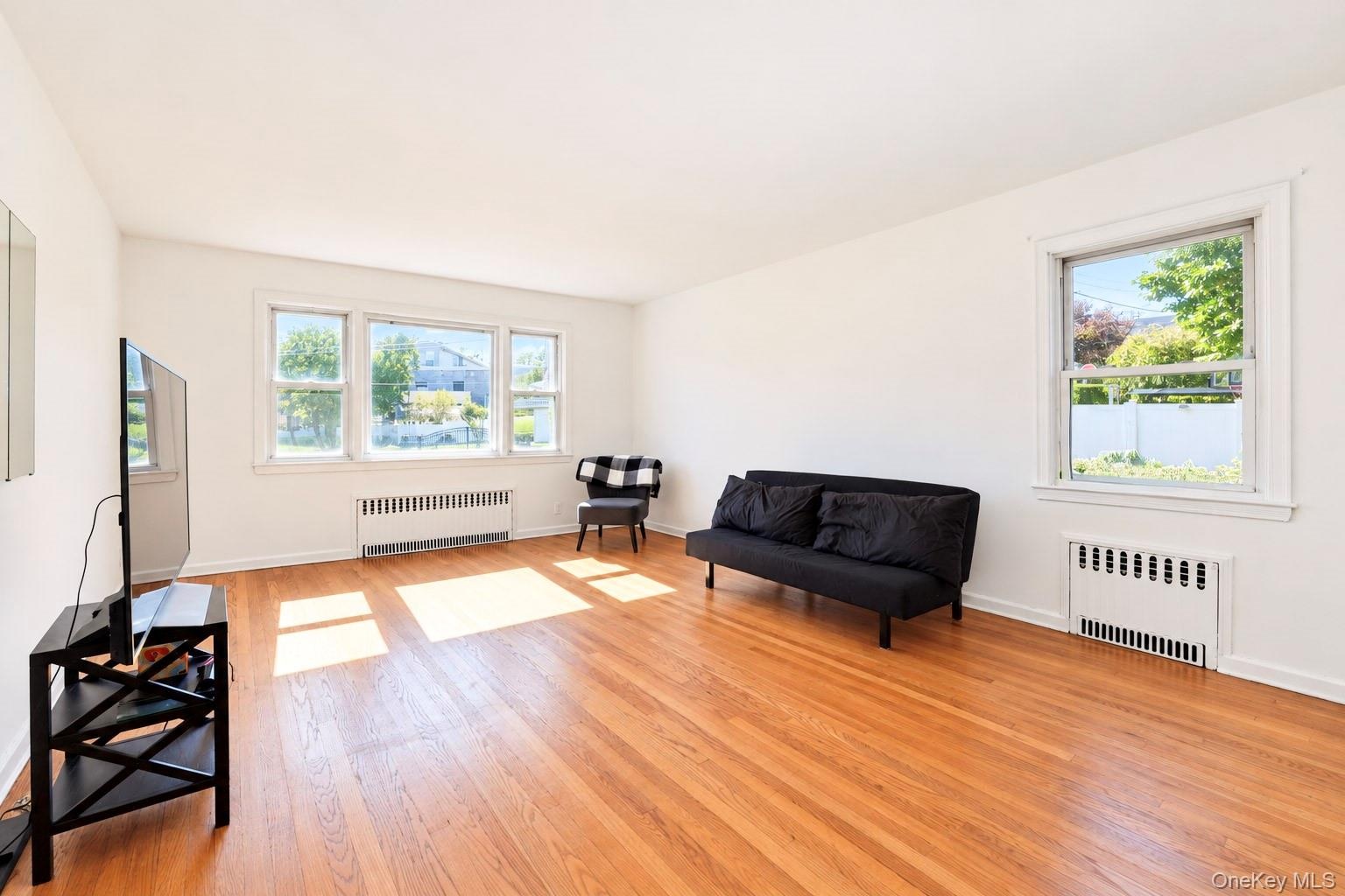 First Floor Unit living room with dining area