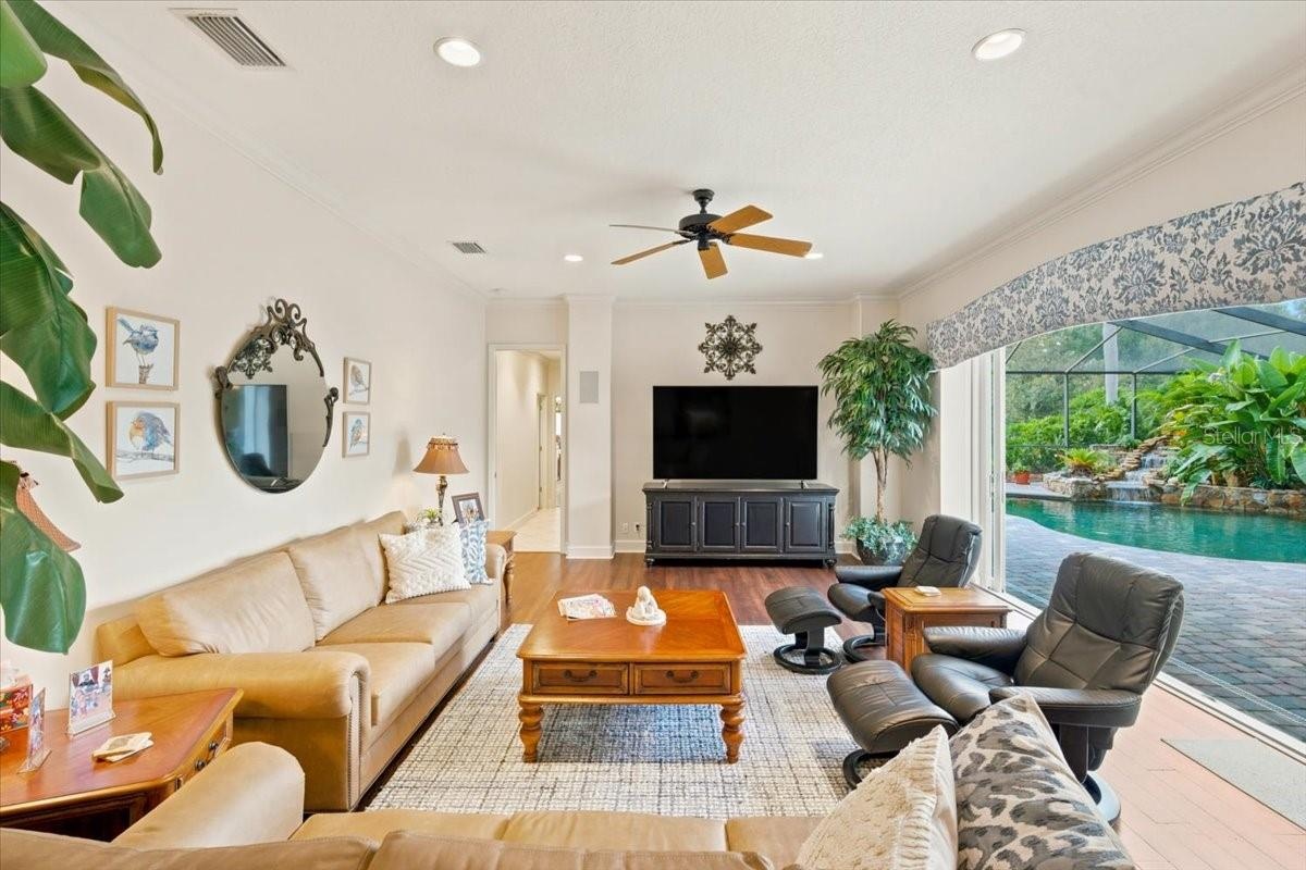 Spacious family room connects seamlessly with the kitchen and outdoor living areas.