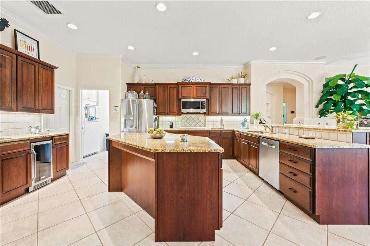 Spacious kitchen features extensive cabinetry, generous counter space, and premium appliances.