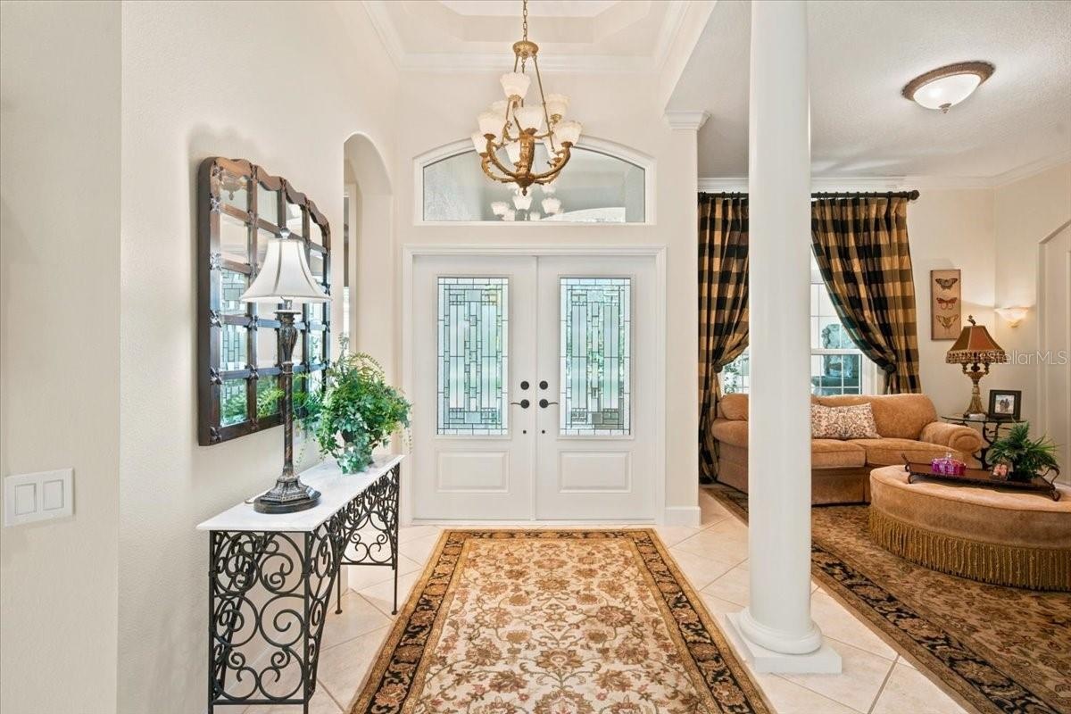 Welcoming entrance introduces the home's impressive scale and custom design.