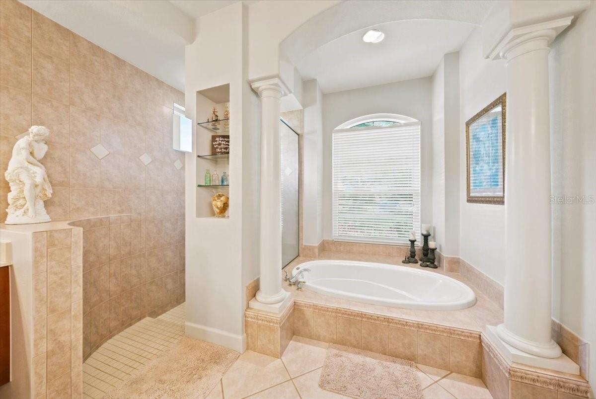 Relaxing soaking tub creates a comfortable retreat within the primary bath.