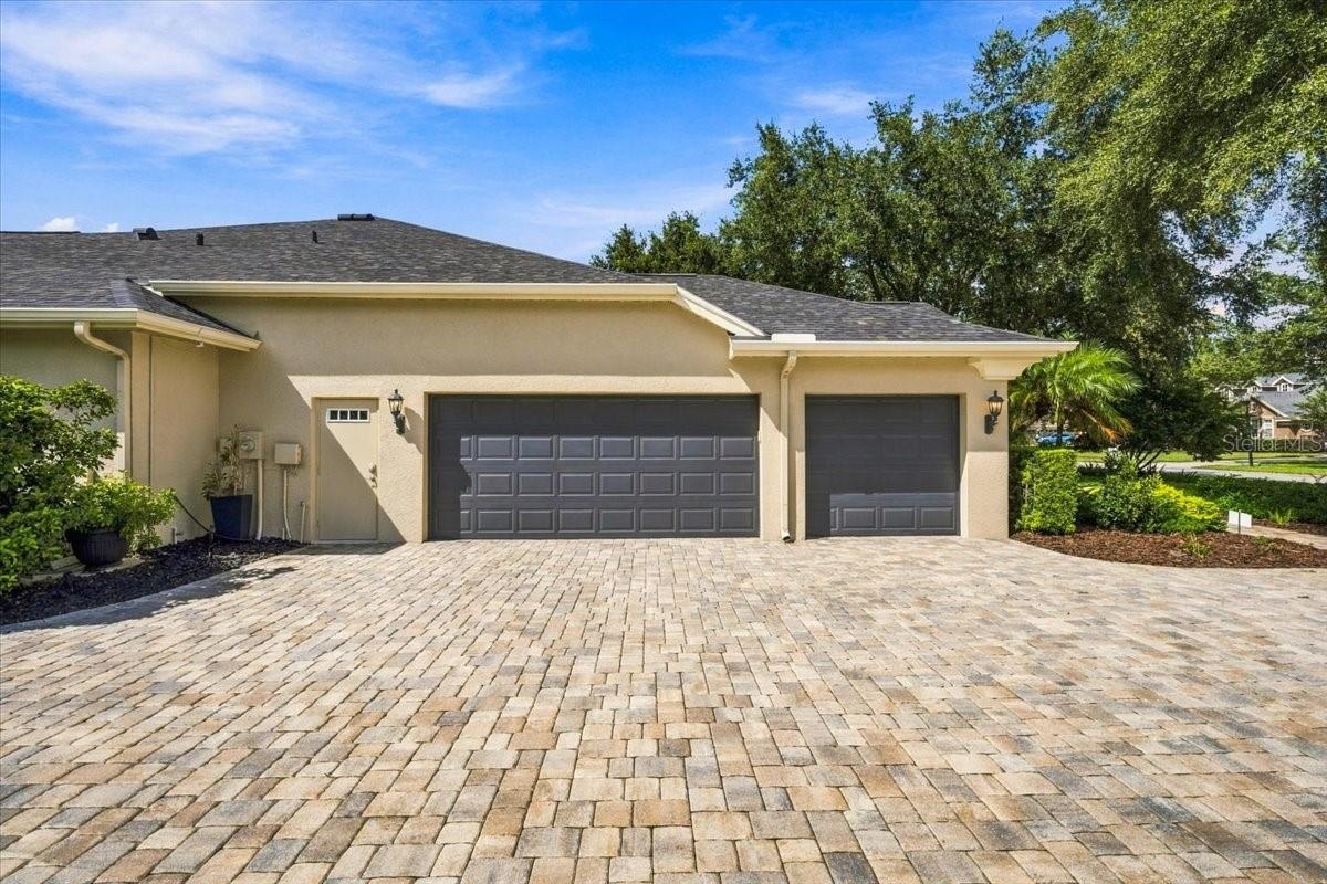 Spacious side-entry three-car garage enhances convenience and curb appeal.