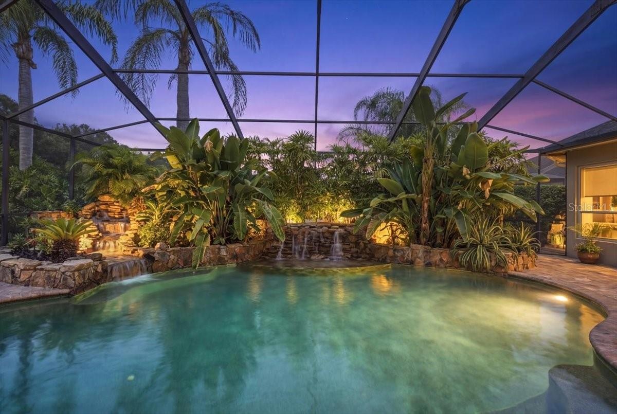 Color-changing pool lights enhance the outdoor setting after sunset.