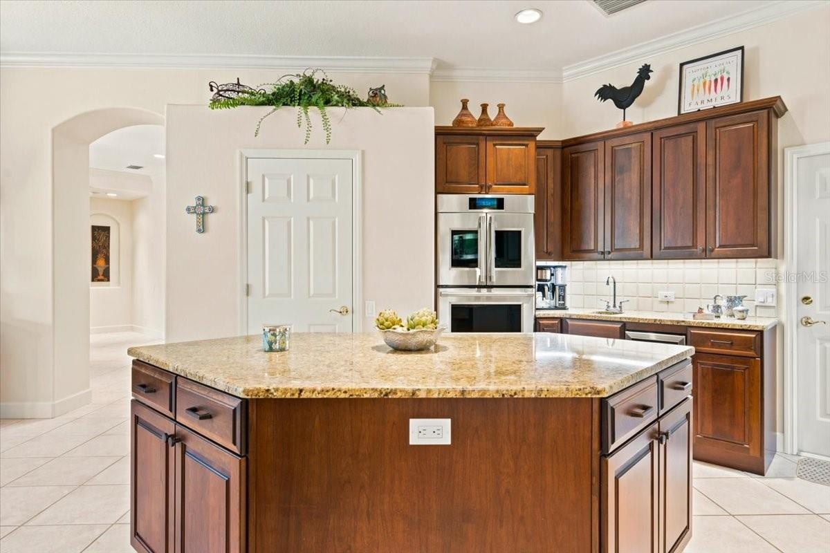 Abundant cabinetry provides excellent storage and workspace.