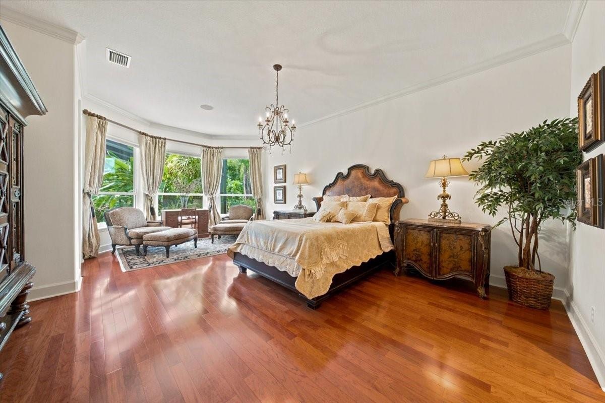 Private primary suite is thoughtfully positioned in its own wing of the home.
